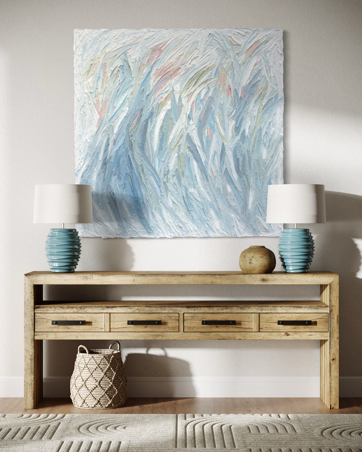 Wooden console table with decorative items and abstract painting above it