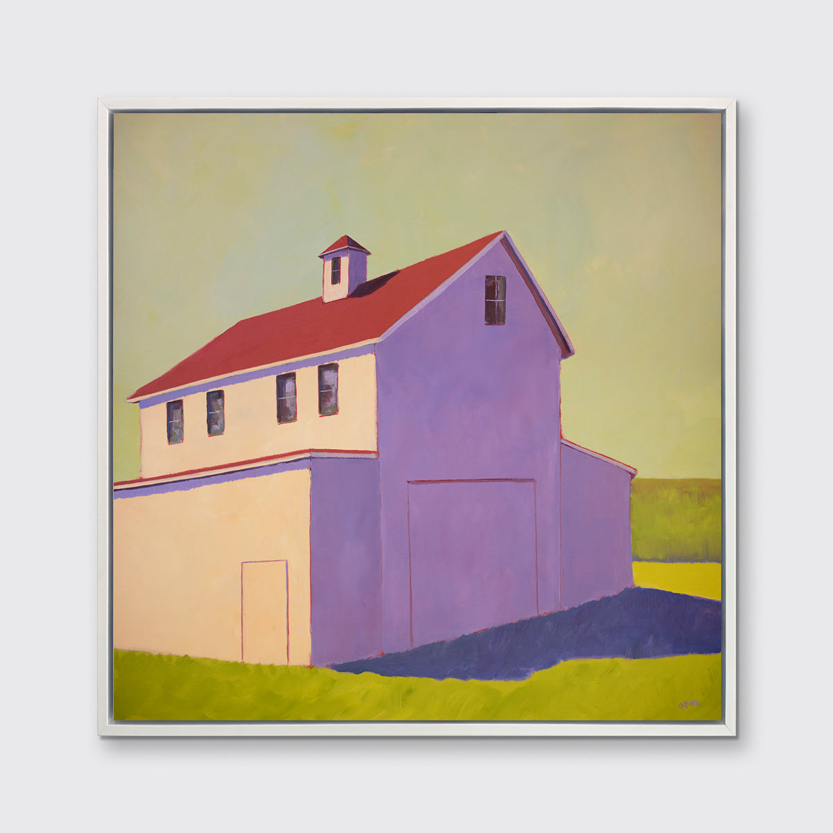 A lavender, green, beige and red contemporary barn print in a white floater frame hangs on a white wall.