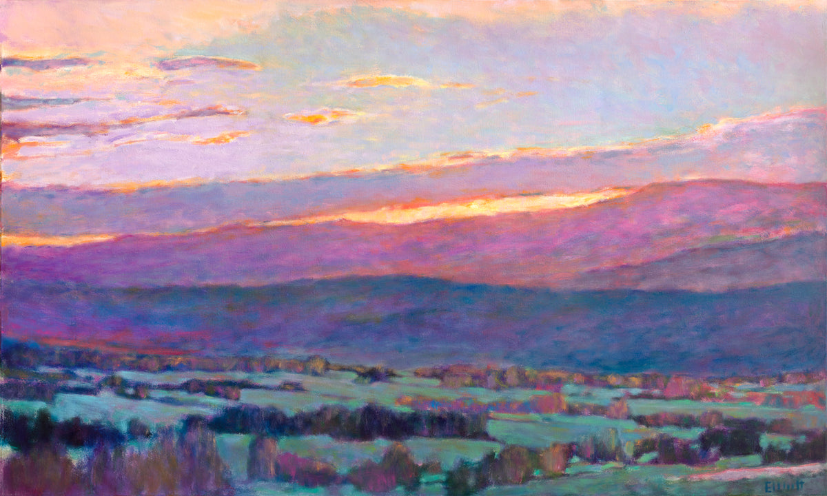A giclee print of a landscape with deep blue and purple hills in the background and the sun peaking through the clouds.