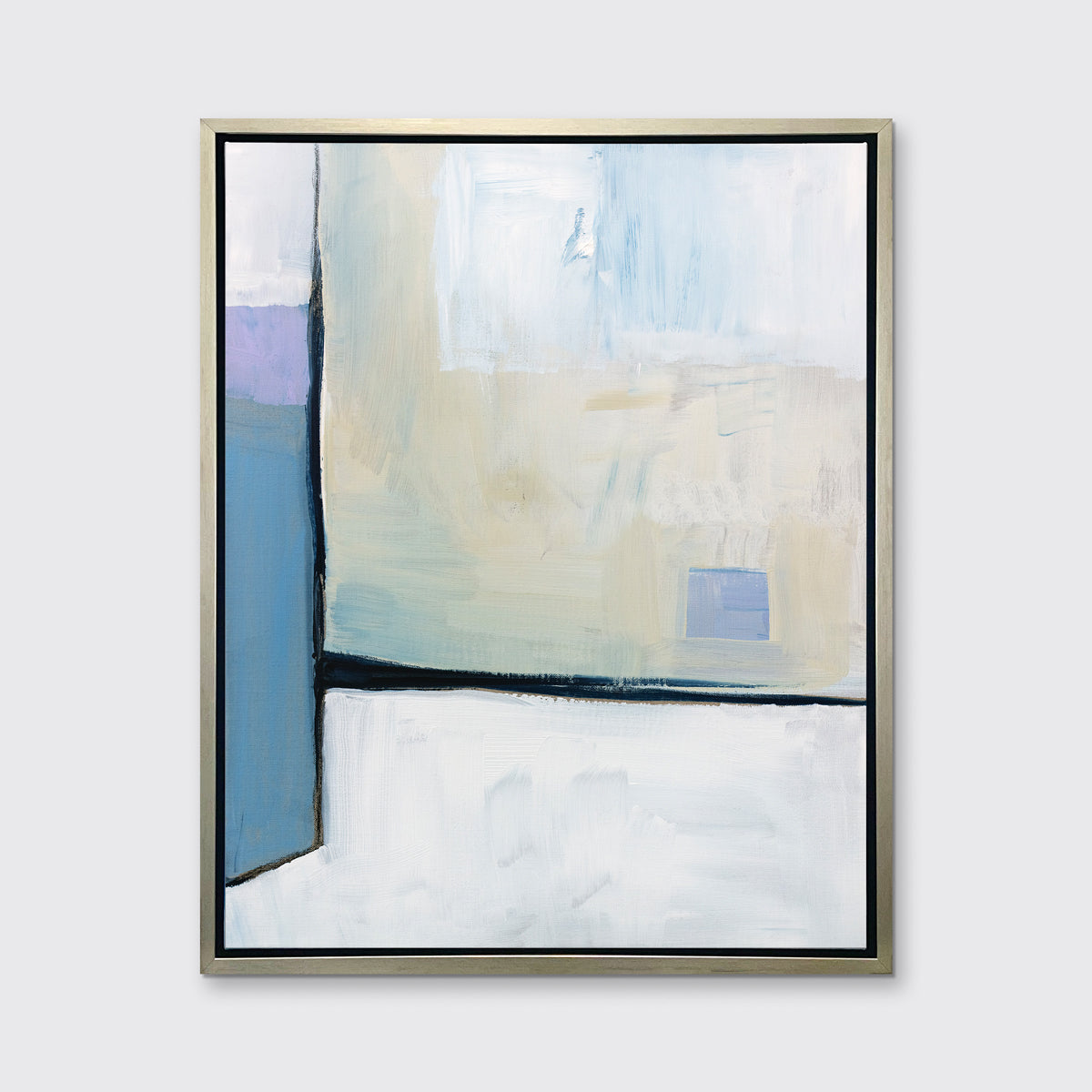 A white, black, blue and chartreuse abstract print in a silver floater frame hangs on a white wall.