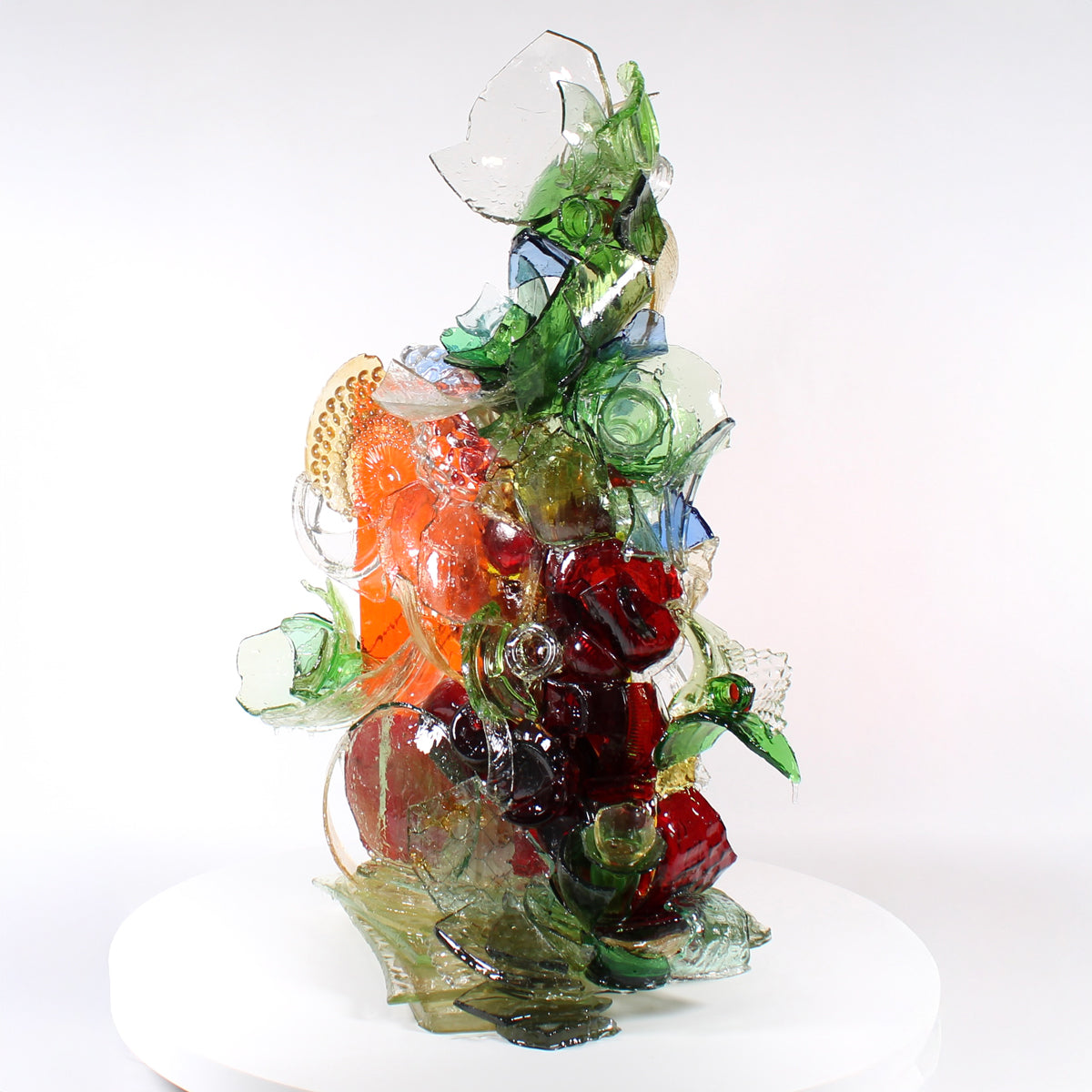 Colorful glass sculpture on a white background.