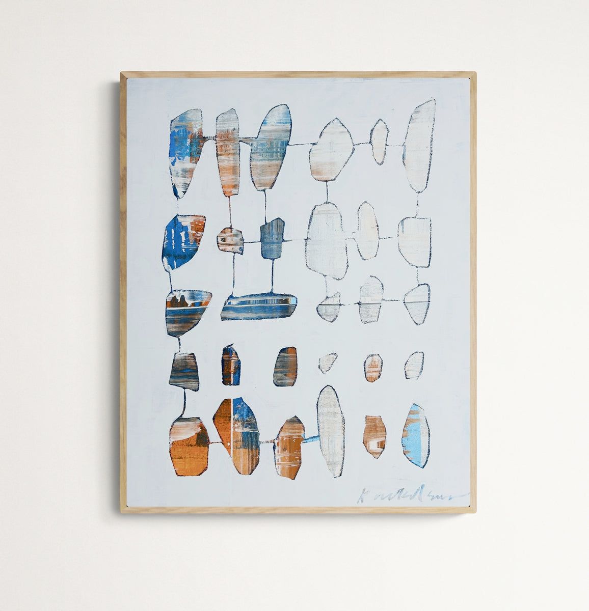 Framed abstract art with geometric shapes on a light background.