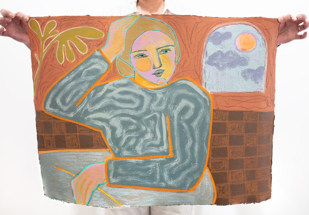 A person holds a yellow, orange, and grey abstracted figure painting in front of a white wall. 