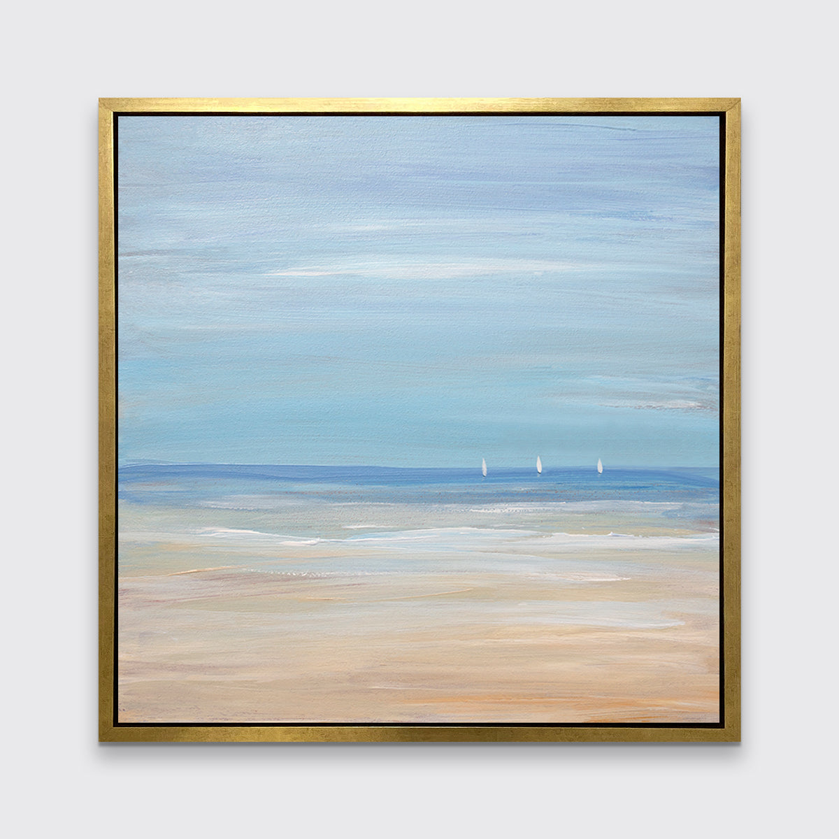 A blue, beige and white abstract seascape print with three small sailboats in a gold floater frame hangs on a white wall.