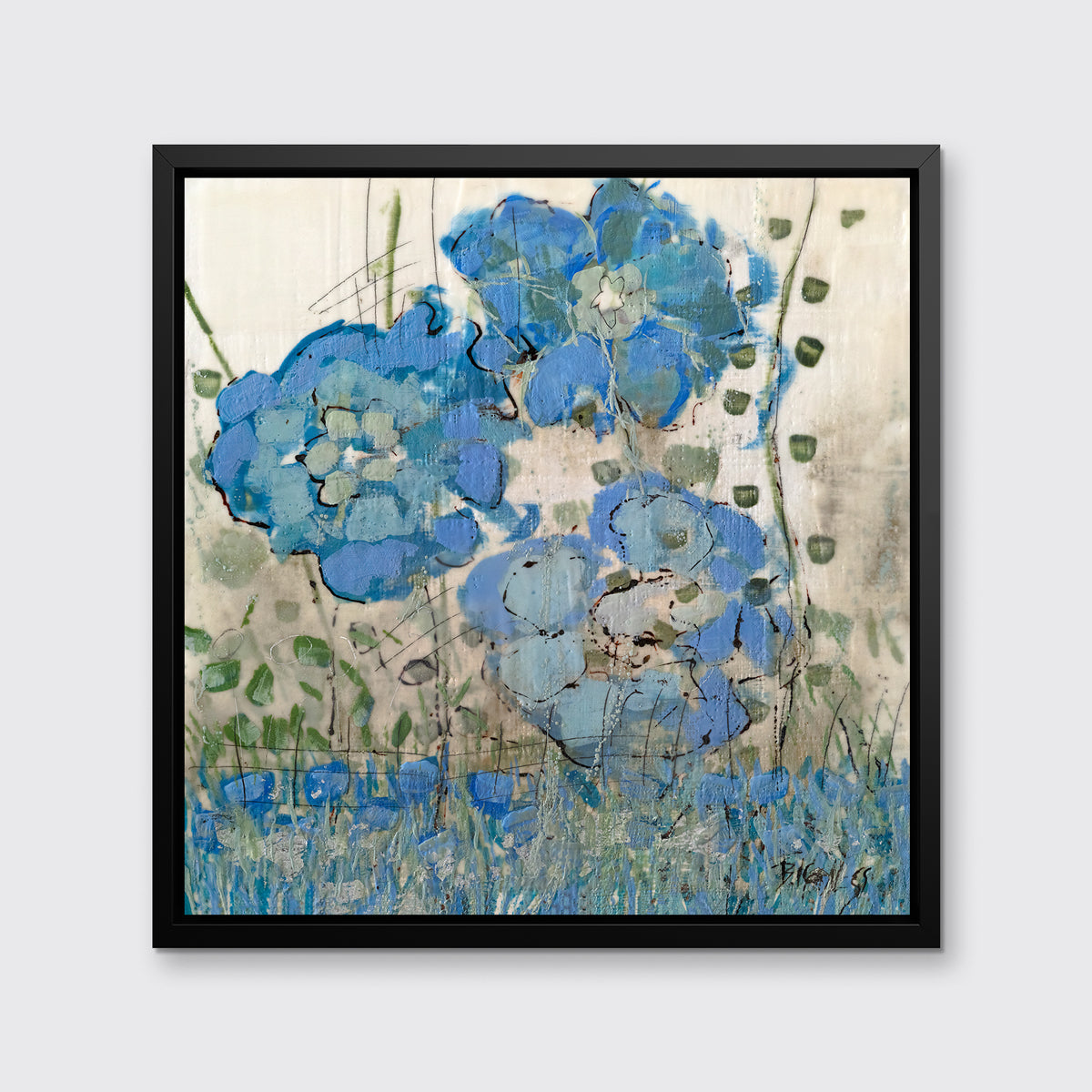 A blue floral print in a black floater frame hangs on a white wall.