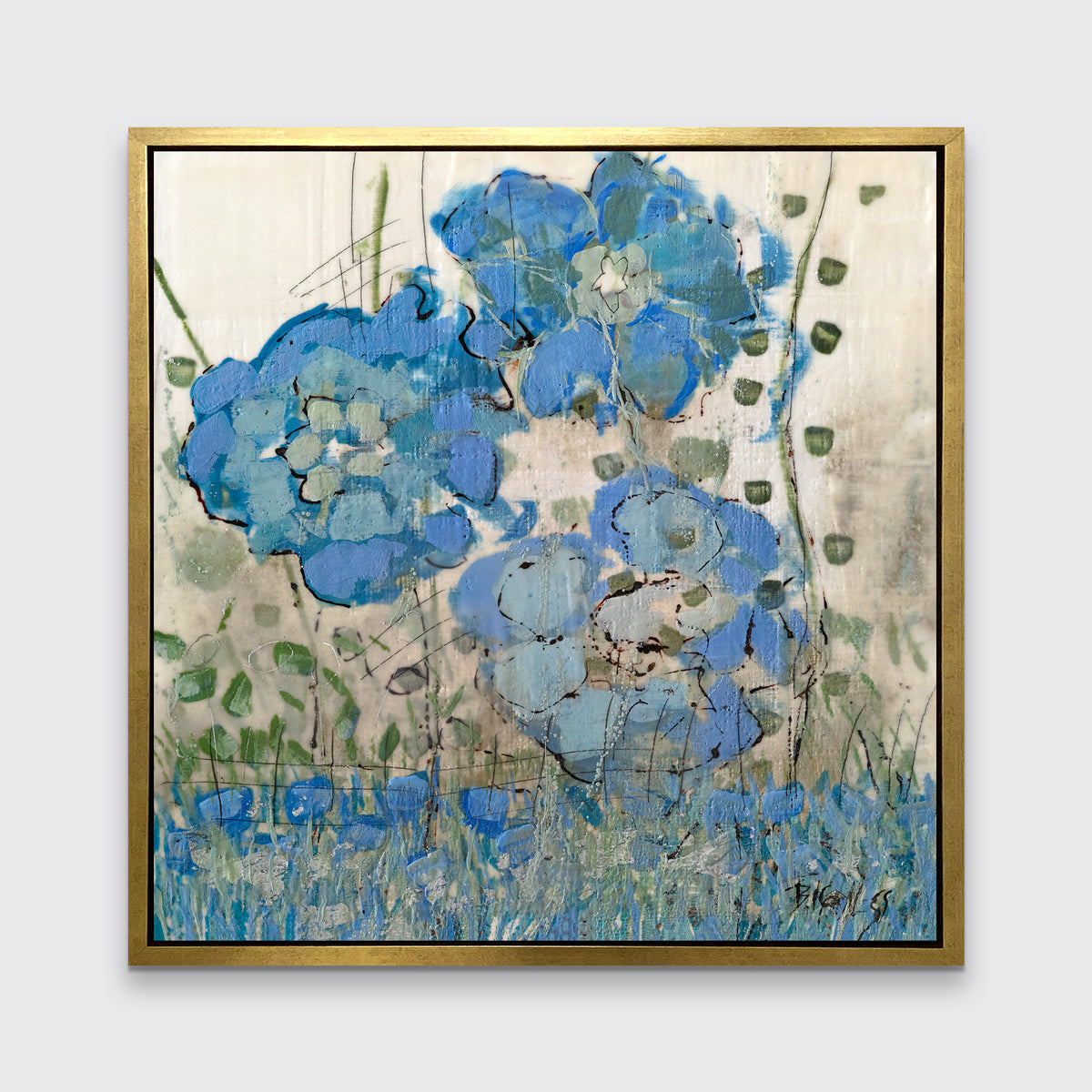 A blue floral print in a gold floater frame hangs on a white wall.