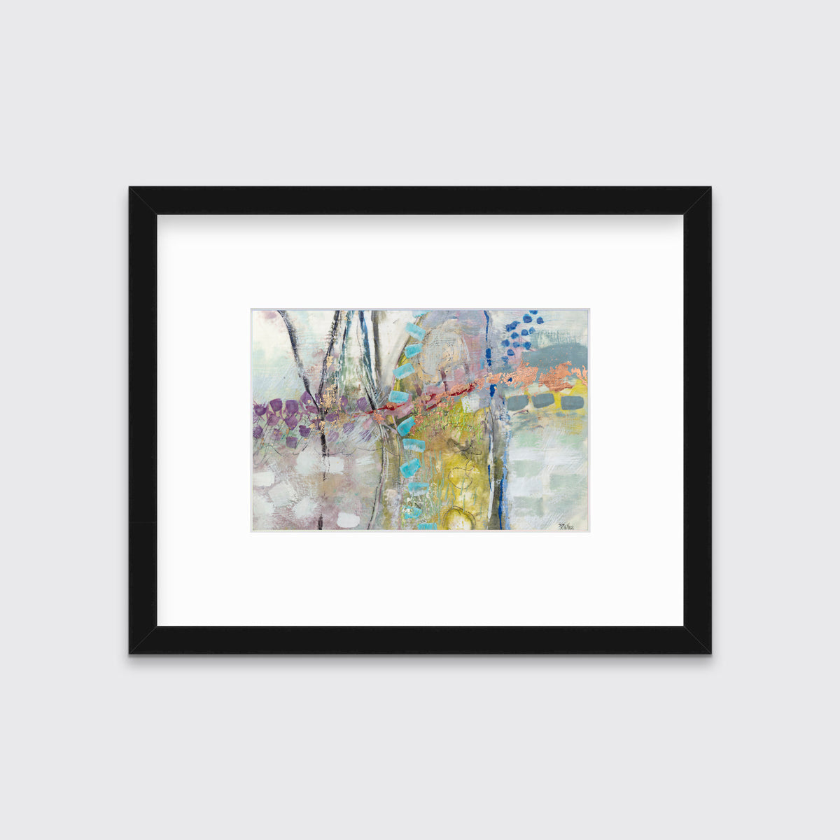 A multicolored abstract print in a black frame with a mat hangs on a white wall.