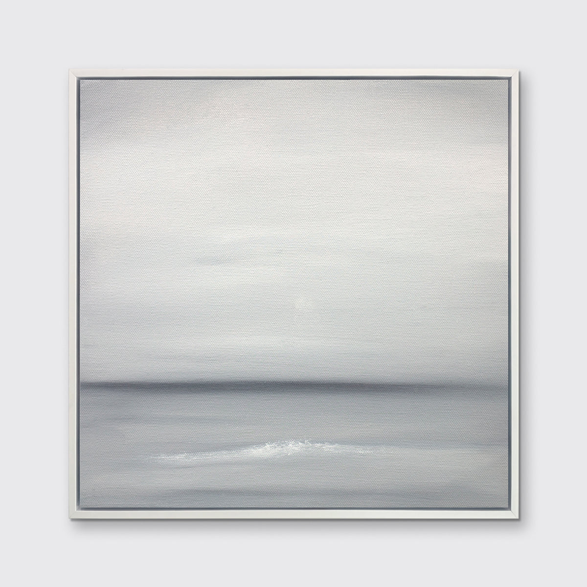 A tonal grey abstract print in a white floater frame hangs on a white wall.