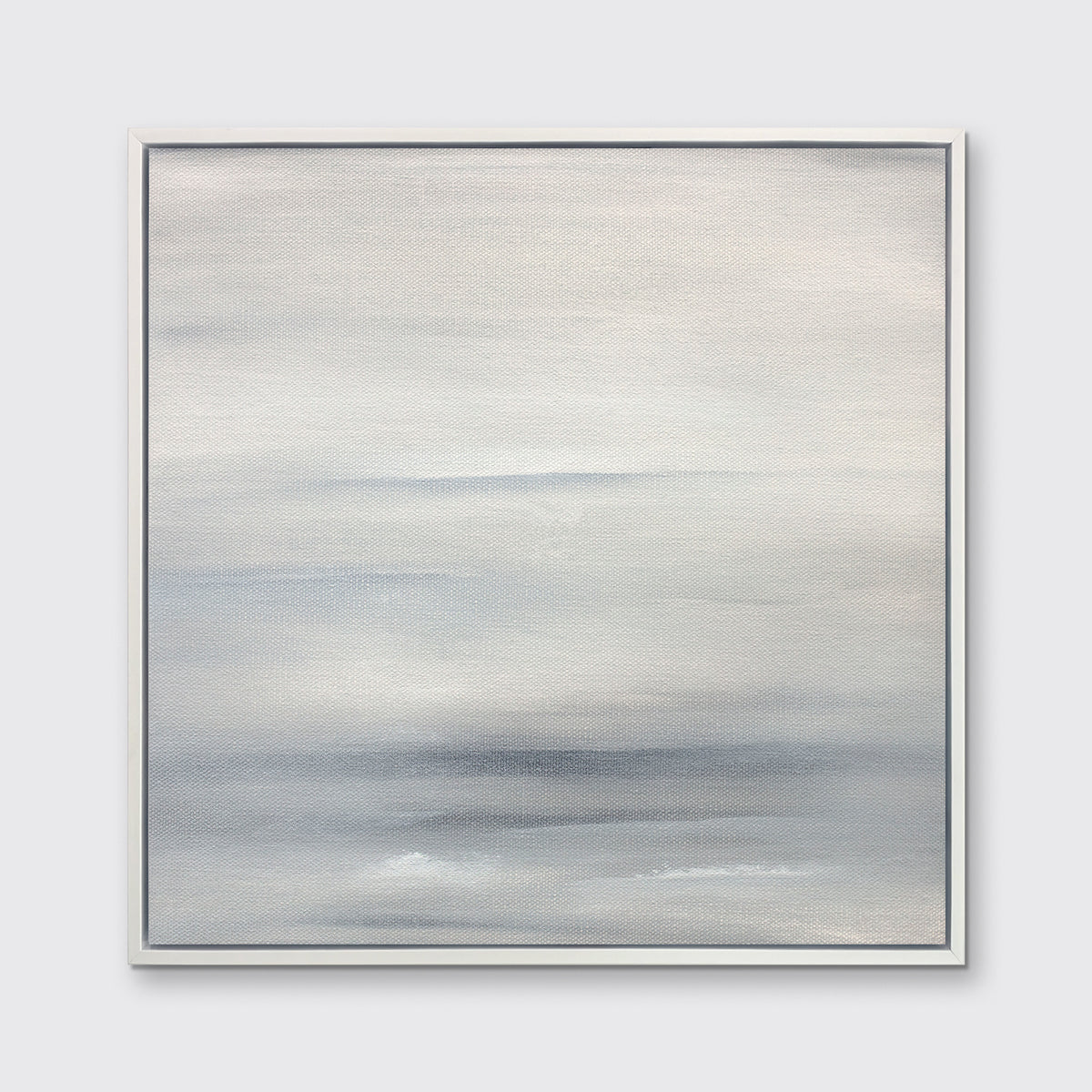 A tonal grey abstract print in a white floater frame hangs on a white wall.