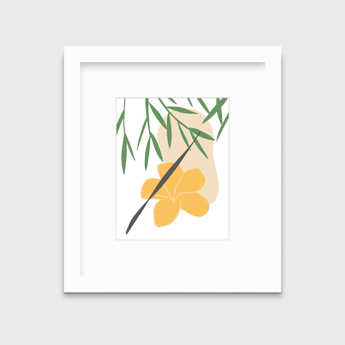A green and yellow abstract botanical art print framed in a white frame hangs on a light wall.