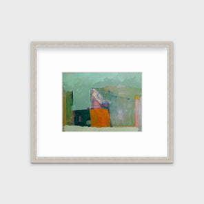 A green abstract print by Christine Averill-Green in a silver frame with a mat hangs on a white wall.