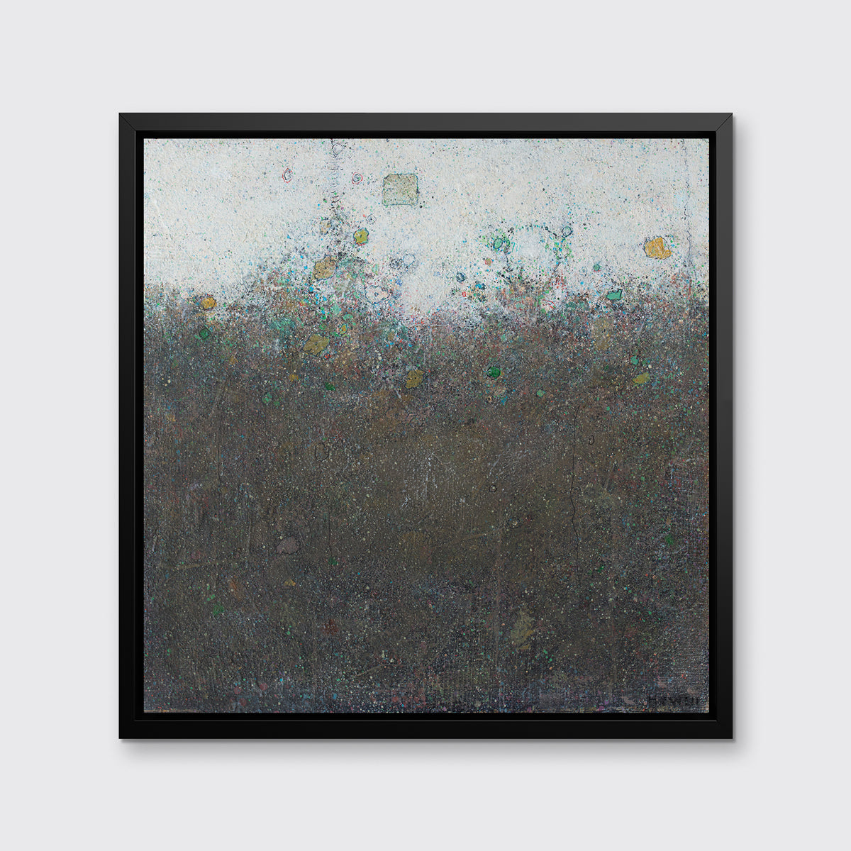 A dark green abstract landscape print in a black floater frame hangs on a white wall.