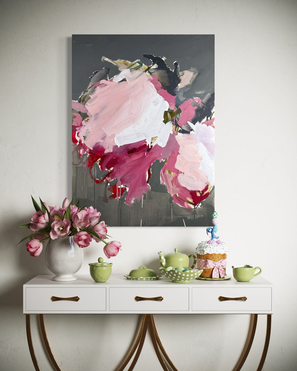 Floral painting above a white console table with decorative items