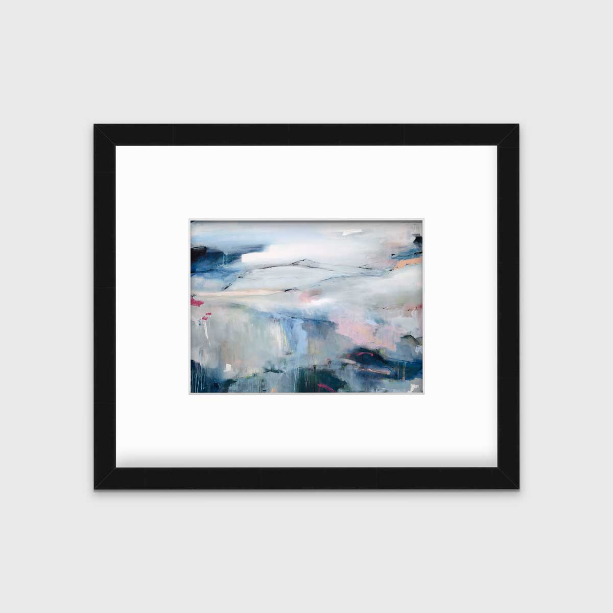 A blue abstract print in a black frame with a mat hangs on a white wall.