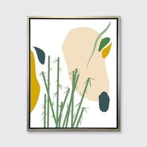 An abstract yellow, beige, blue, and green botanical art print framed in a silver floater frame hangs on a light wall.