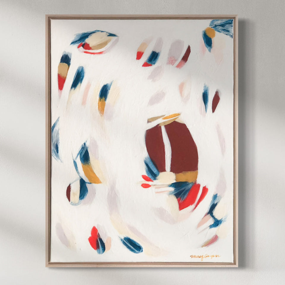 Framed abstract art print with colorful shapes on a white background