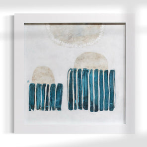 Framed abstract art piece with blue and beige elements on a white background