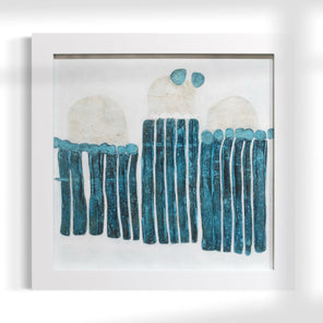 Framed abstract artwork with blue and white elements on a white background