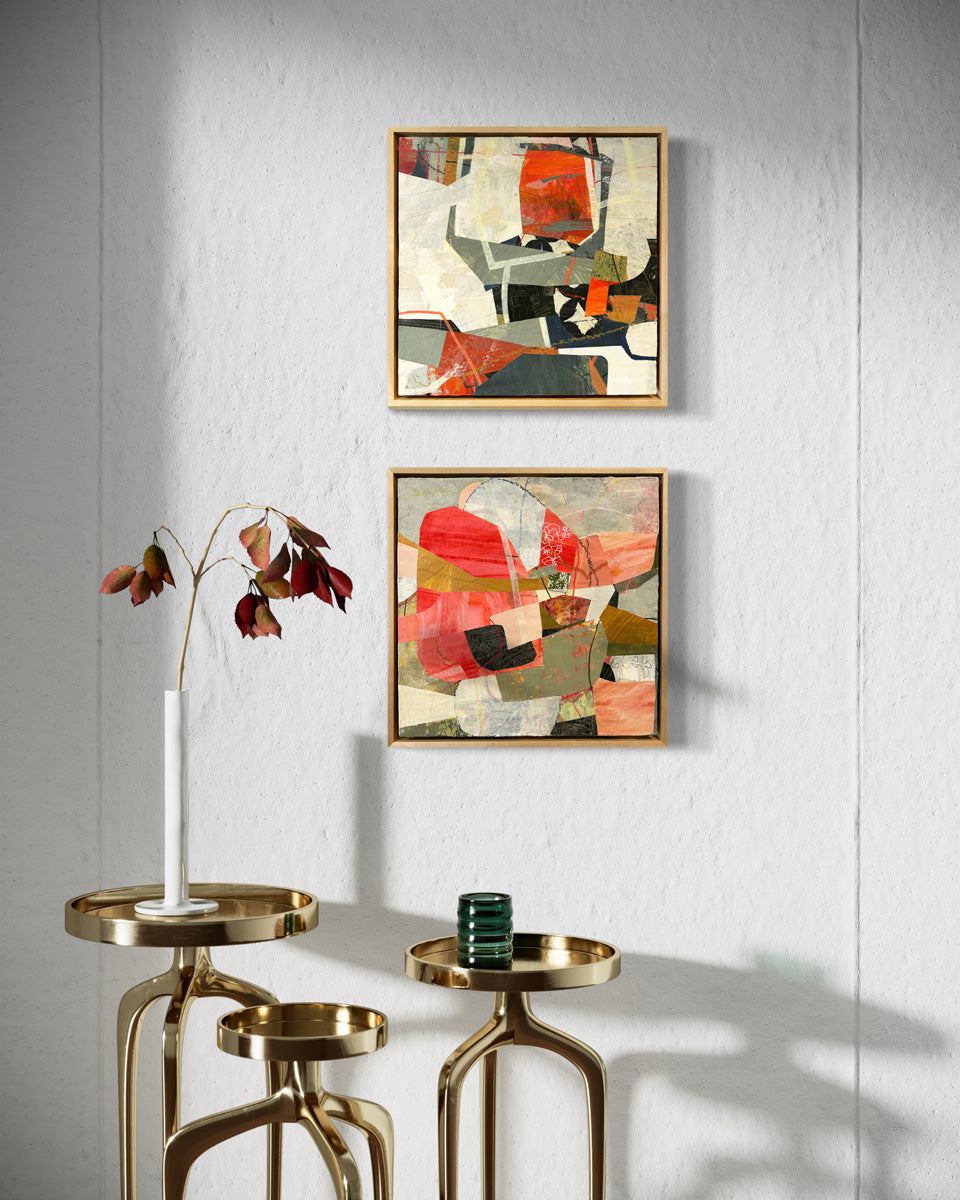 Two framed abstract collage artwork featuring geometric shapes in shades of red, beige, and green, with a white background hanging on a white wall.
