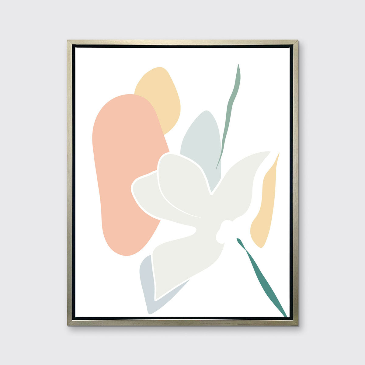 A light abstract botanical art print framed in a silver floater frame hangs on a light wall.