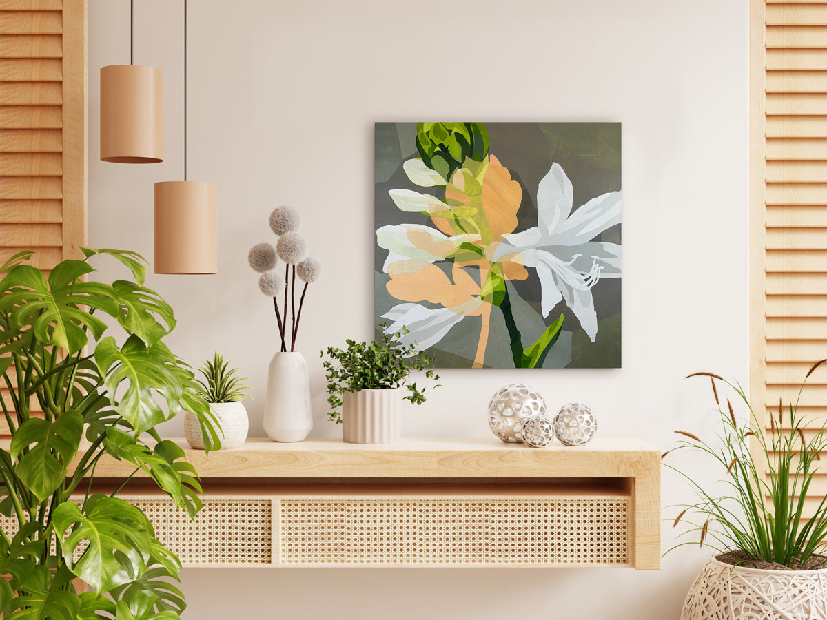 Modern interior with a wooden console table, decorative plants, and a floral painting on the wall.