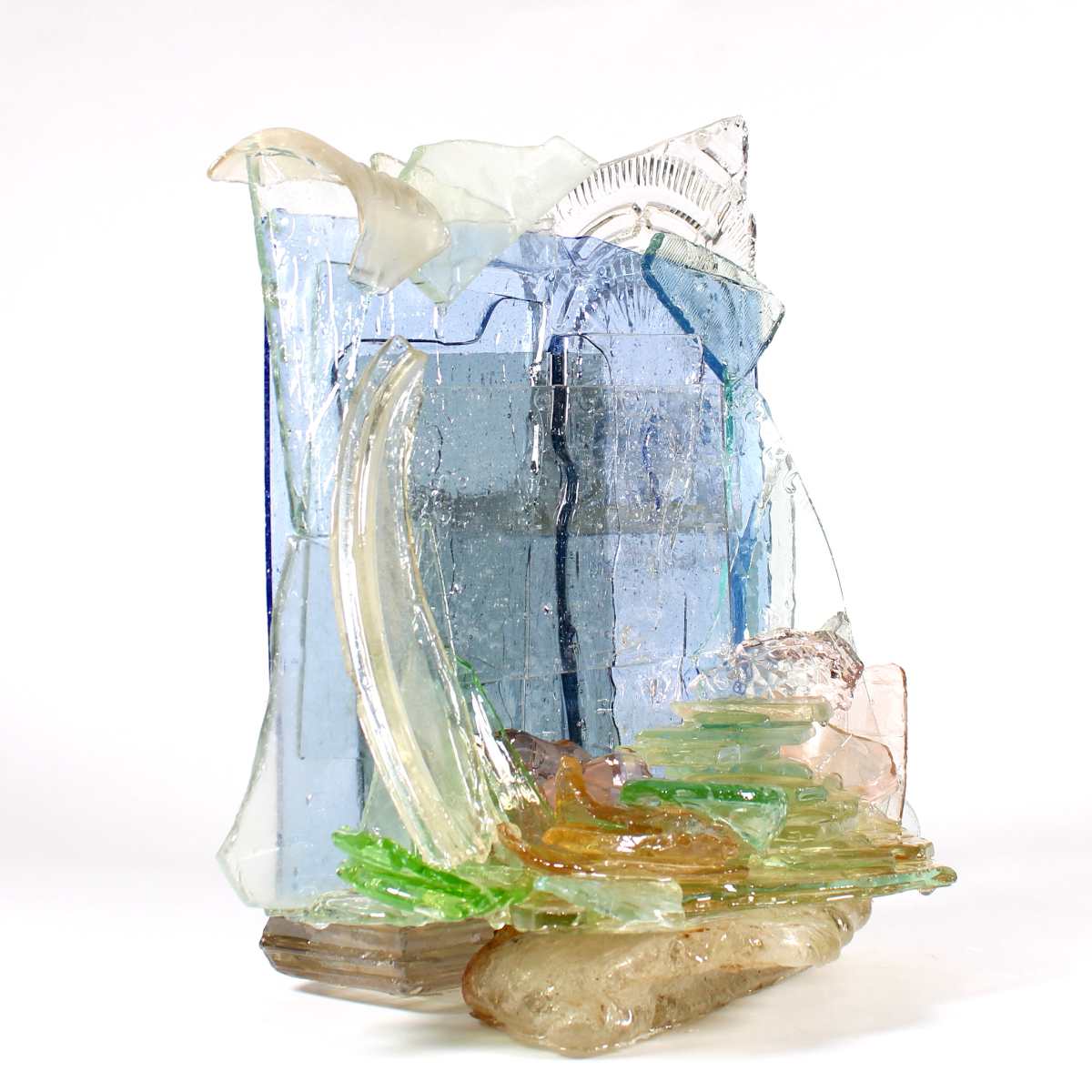 A glass sculpture on a white background.