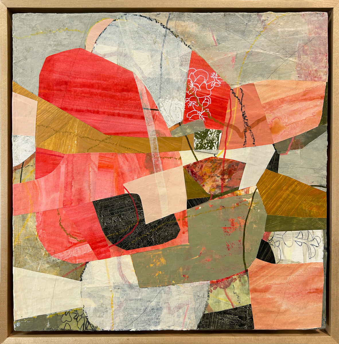 A framed abstract collage artwork featuring geometric shapes in shades of red, beige, and green, with a white background hanging.