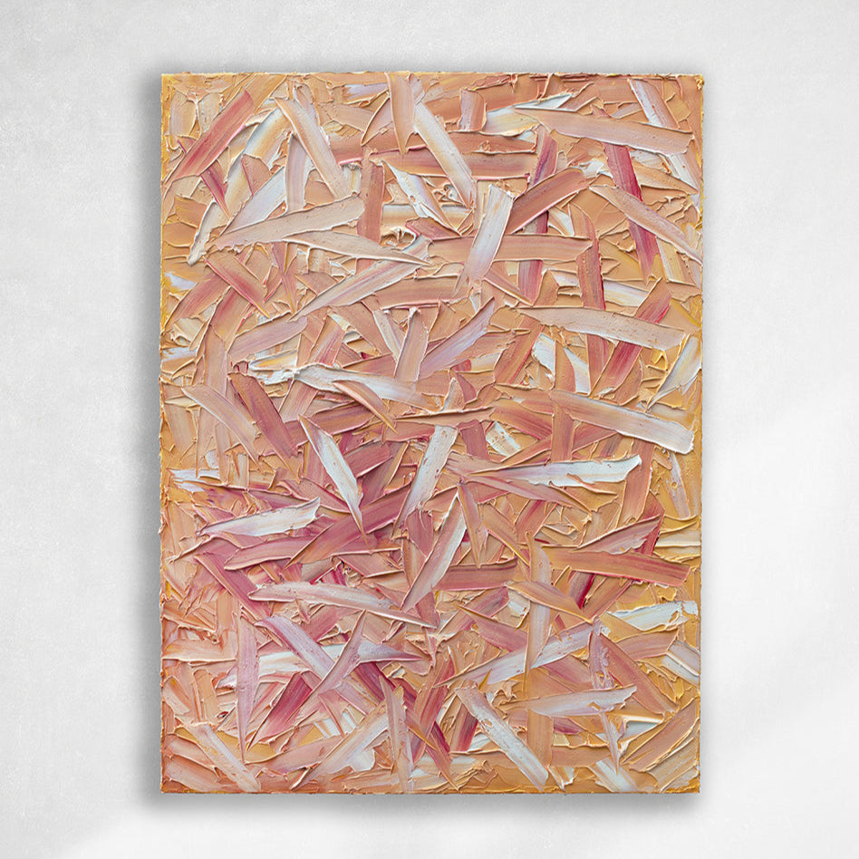 A orange, pink, coral and white thickly textured abstract painting hangs on a white wall.