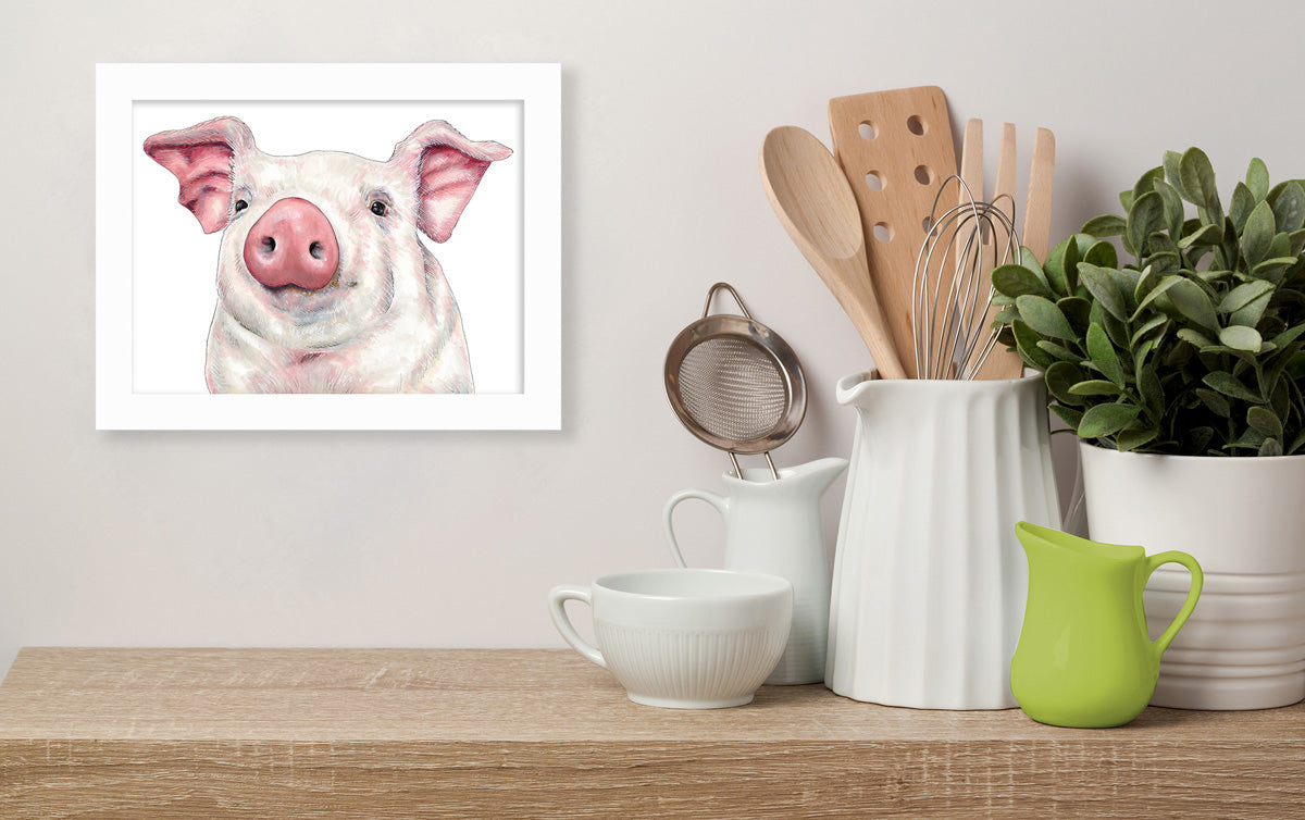 An illustration of a pig hangs on a white wall above a wooden floating shelf on which rests kitchen utensils and a potted plant. 