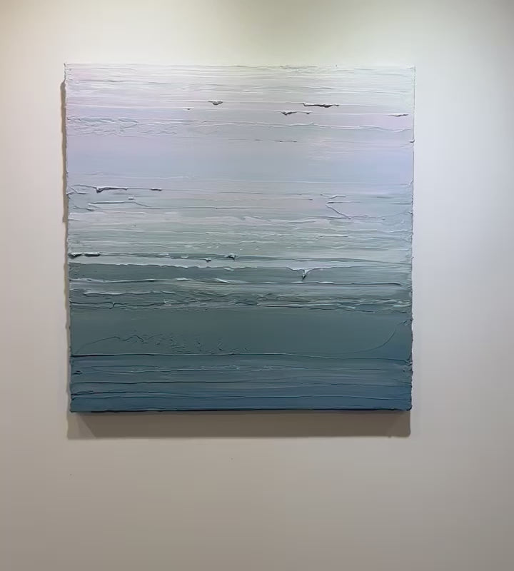 A video of a teal blue, teal green, lavender and pale lavender textured abstract painting by Teodora Guererra hangs on a white wall.