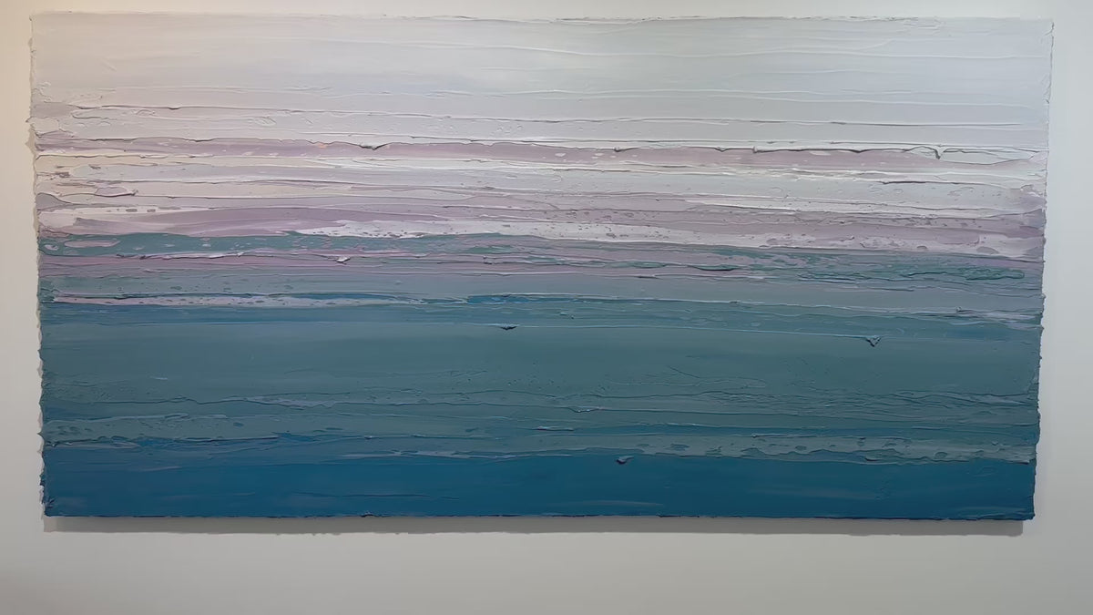 A video of a white, lavender, teal and blue abstract heavily textured painting like sculpture by Teodora Guererra hanging on a white wall.