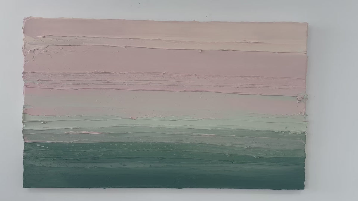 A video of a light Coral, light pink, celadon and hunter green thickly textured abstract painting by Teodora Guererra hanging on a white wall.
