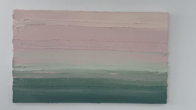 A video of a light Coral, light pink, celadon and hunter green thickly textured abstract painting by Teodora Guererra hanging on a white wall.