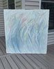 Video of an original Abstract painting with texture in blue, green, white, and pink leaning on a deck.