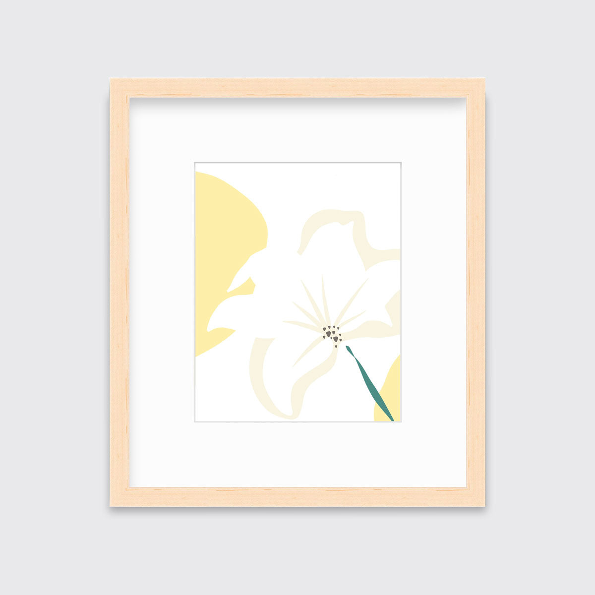 A light yellow abstract botanical art print framed in a neutral wood frame hangs on a light wall.