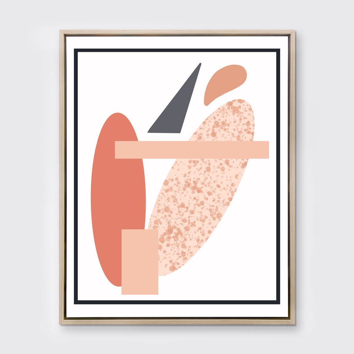A pink and grey abstract art print framed in a neutral wood frame hangs on a light wall.