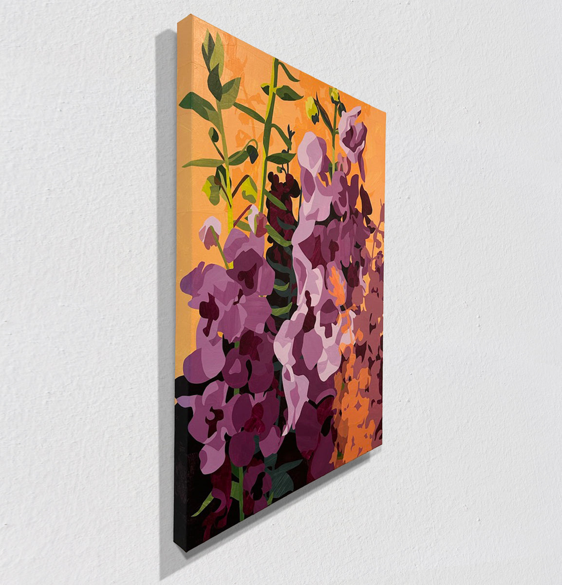 Abstract painting of flowers on a white wall, side view.