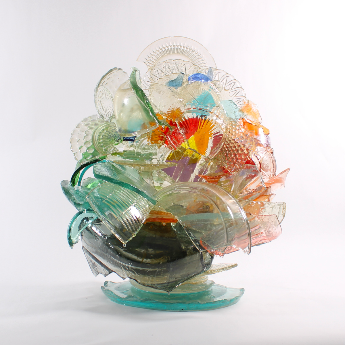 Colorful glass sculpture on a white background.