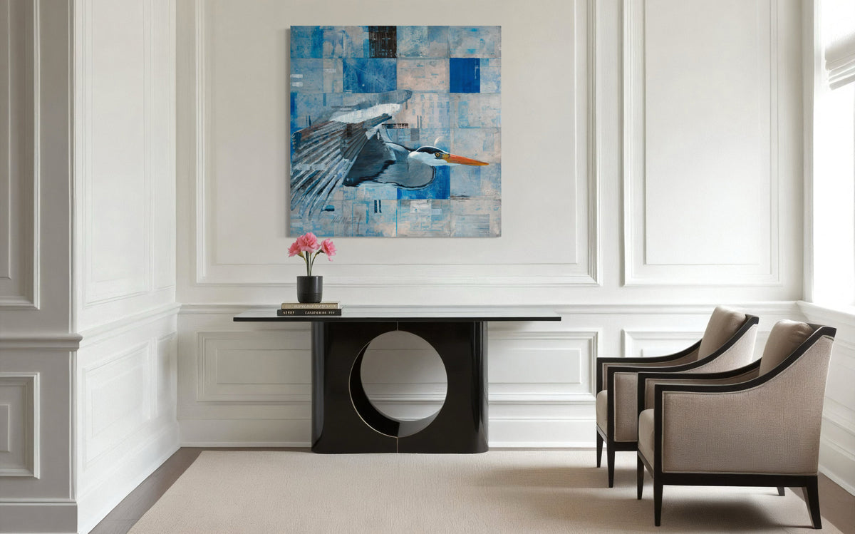 Modern interior with a black round table and gray chairs, featuring a blue abstract painting on the wall.
