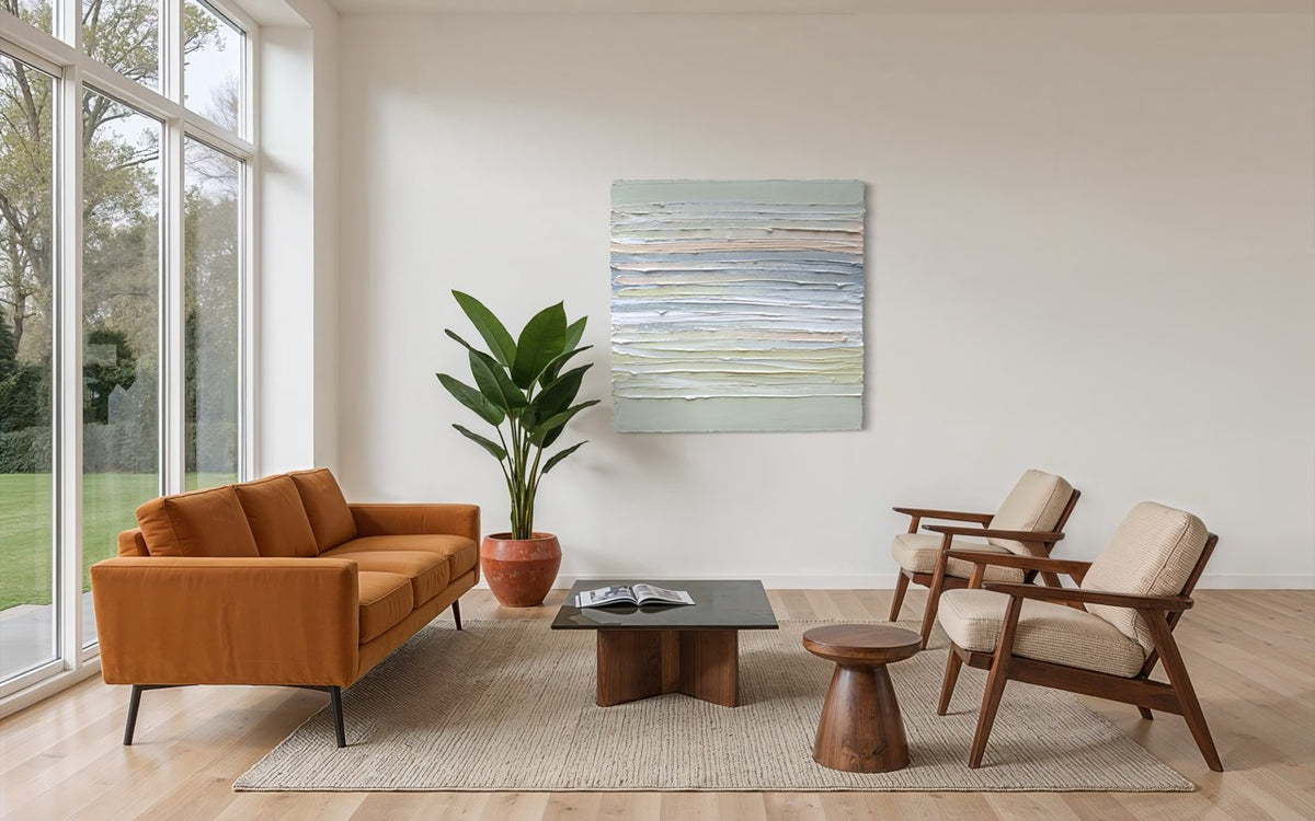 Modern living room with brown sofa, wooden chairs, and an original  abstract painting on the wall.
