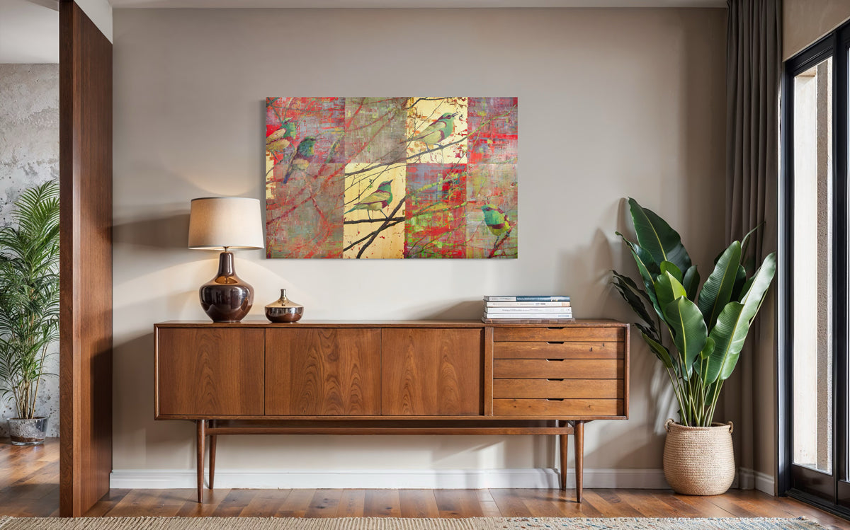 Wooden sideboard with decorative items in a room with a colorful abstract painting on the wall.