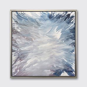A light purple, grey, white and blue abstract print in a silver floater frame hangs on a white wall.