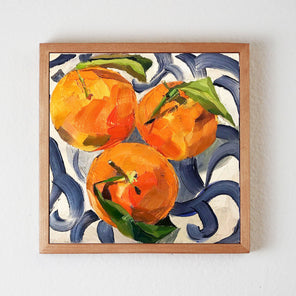 Three Clementines on Blue and White Plate