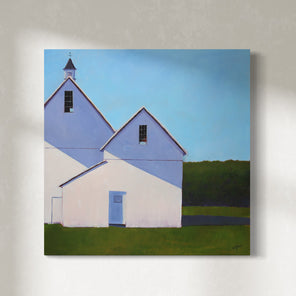 A painting of a white barn with a weather vane in front of a hedge is hung on a gallery wall.