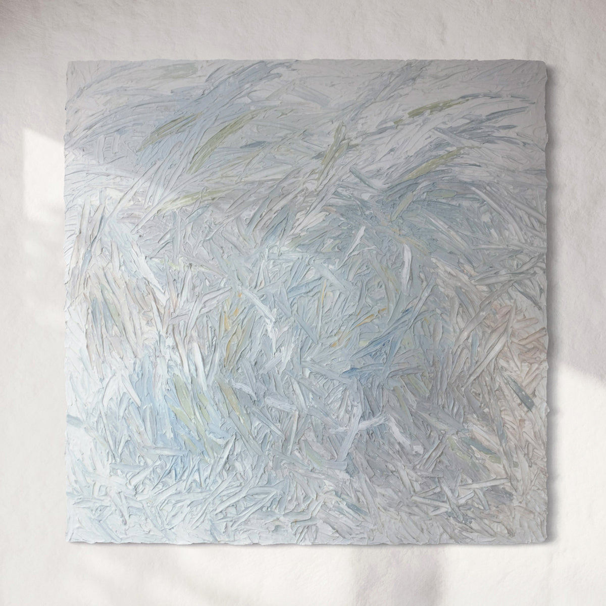 Original abstract painting with thick texture by artist Teodora 'Teo' Guererra hanging on a white wall.