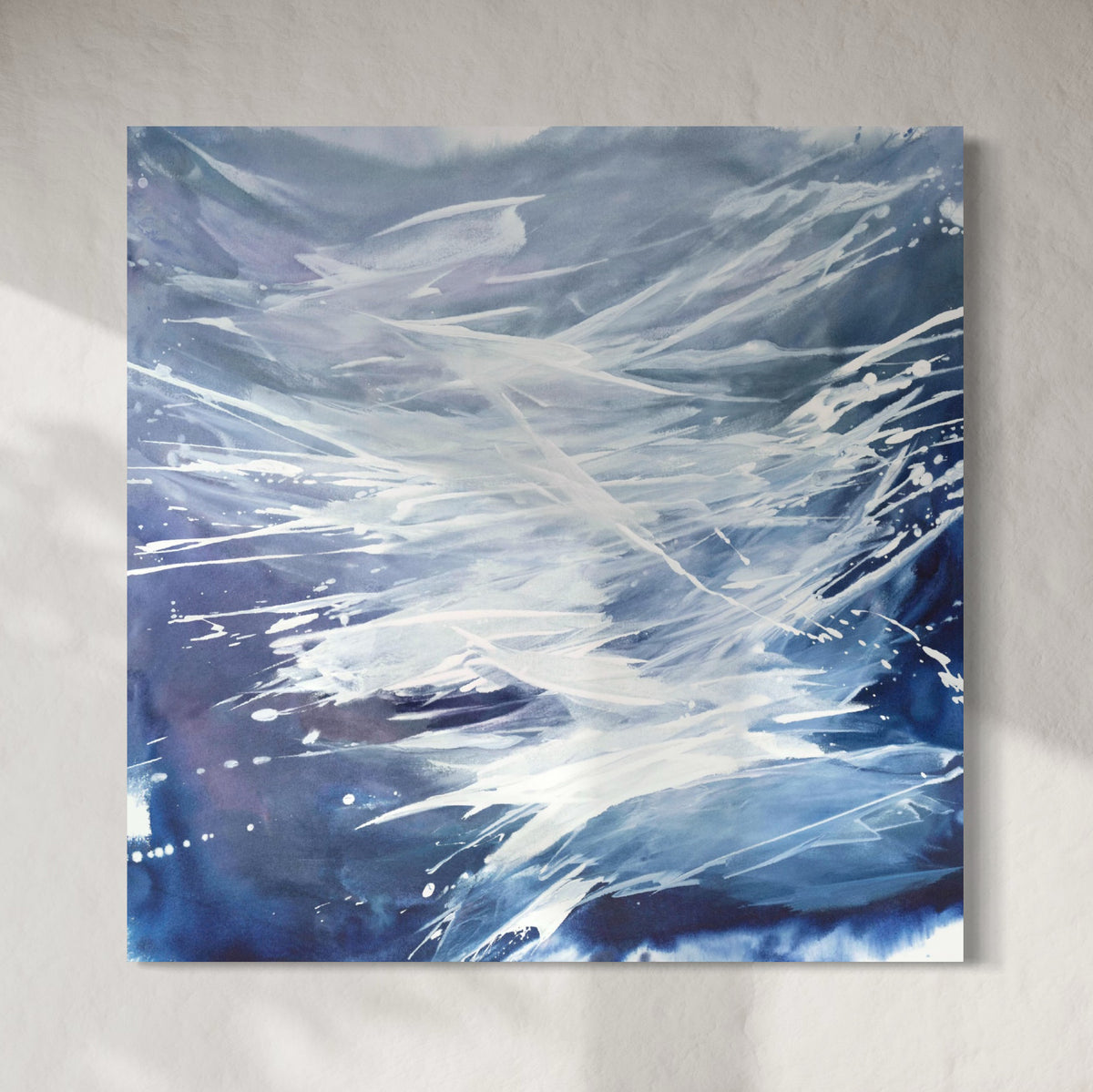 A square-shaped original artwork featuring abstract blue and white colors with a dynamic wave form, signed by Teodora Guererra.