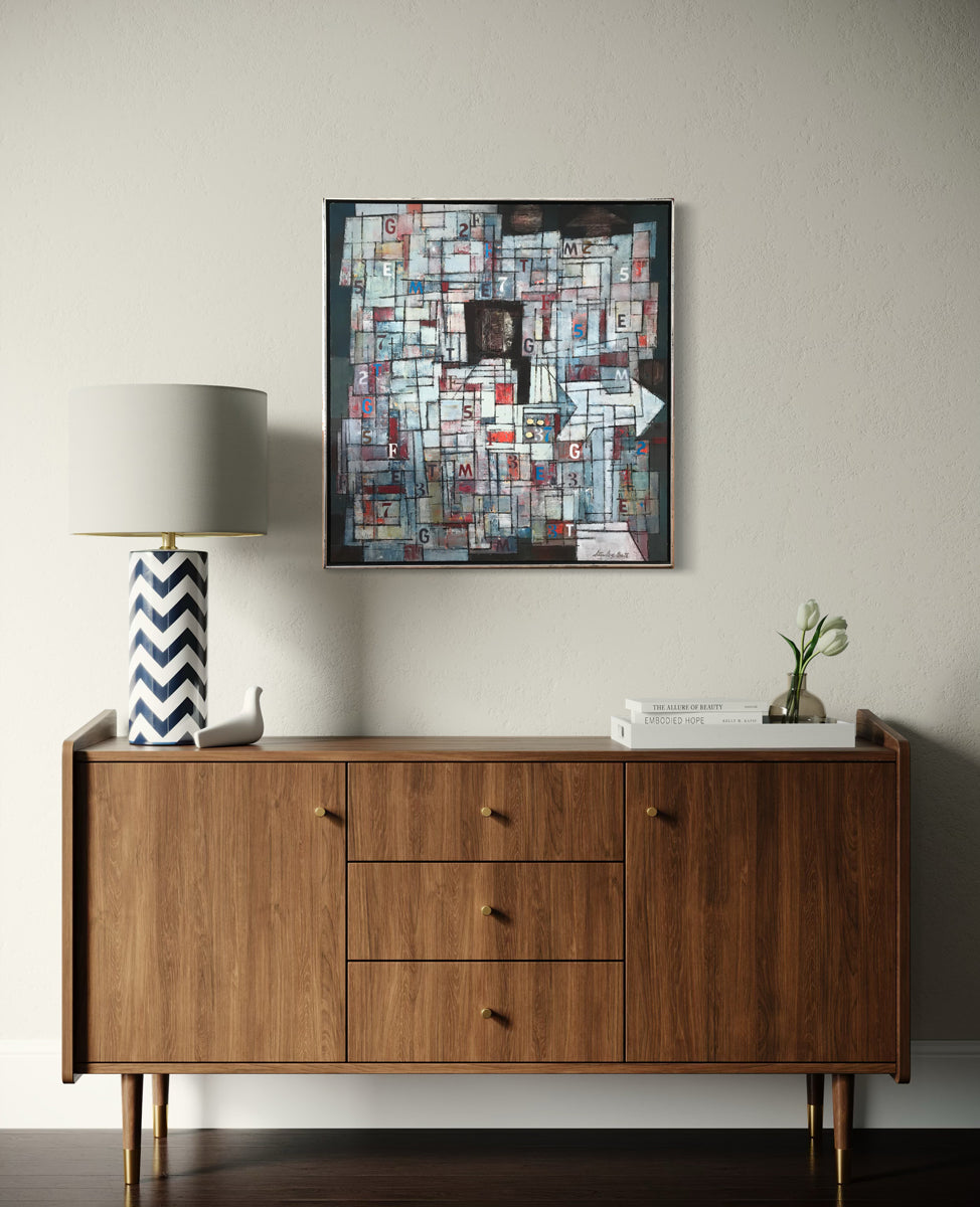 Wooden sideboard with a lamp and abstract art on a wall