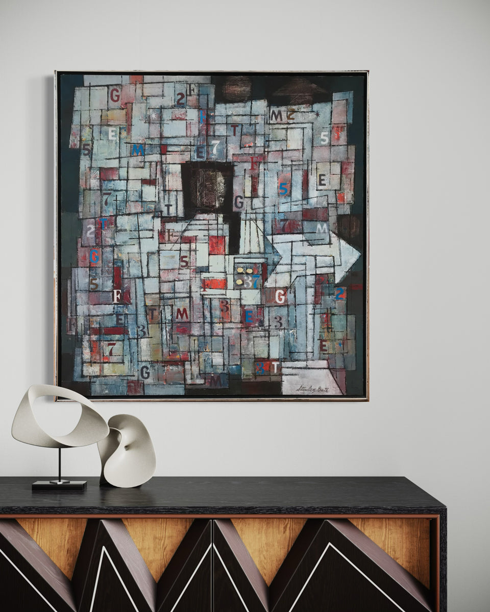 Abstract art piece with letters and numbers on a wall above a console table.