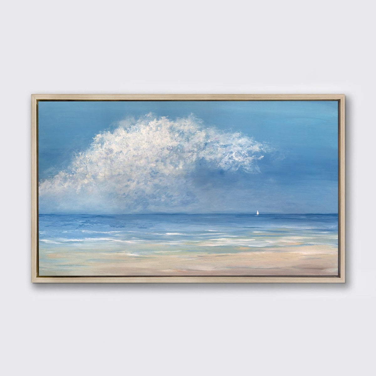 A painting of a contemporary seascape with one loan sailboat hangs on a wall in a white oak floater frame.