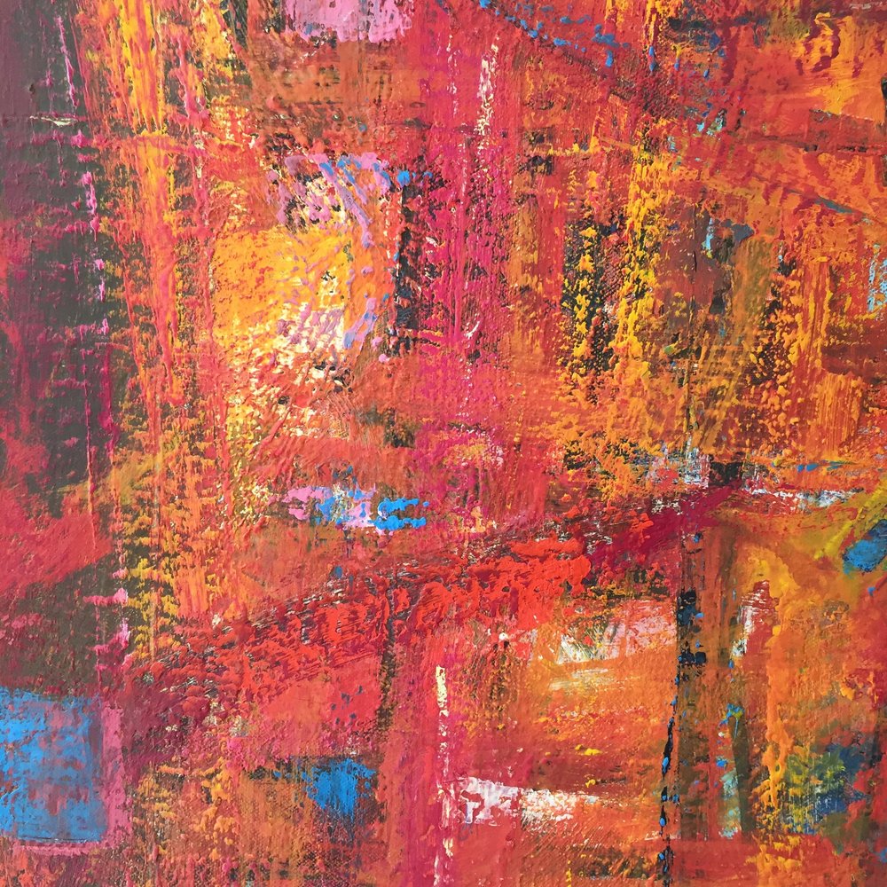 Detail of abstract painting with layers of red, orange, yellow and blue paint.